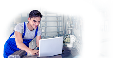 Mechanic looking at a laptop